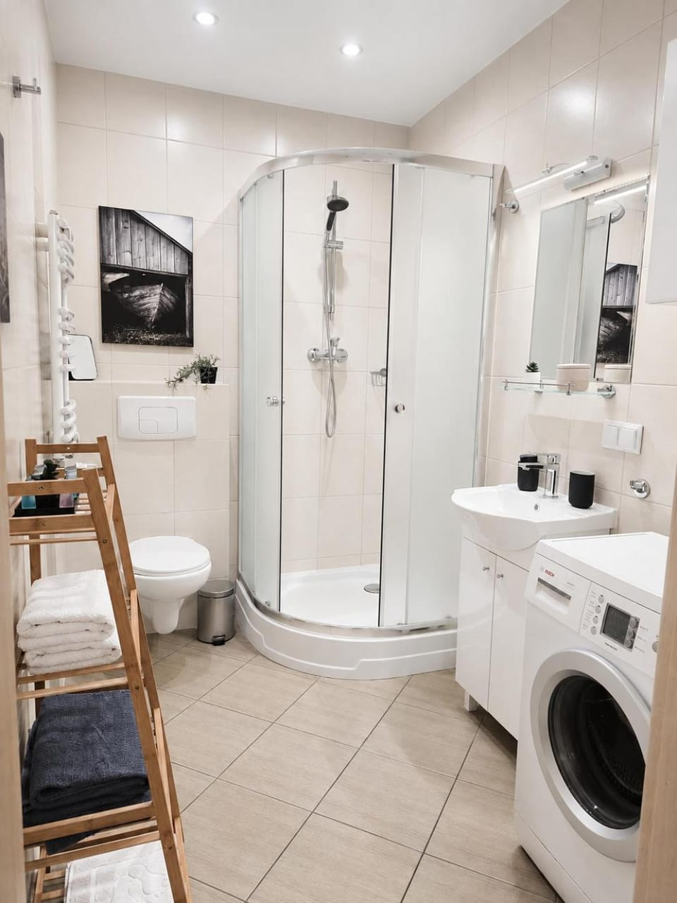 Shower, Toilet, Bathroom, hair dryier, towels, washing machine