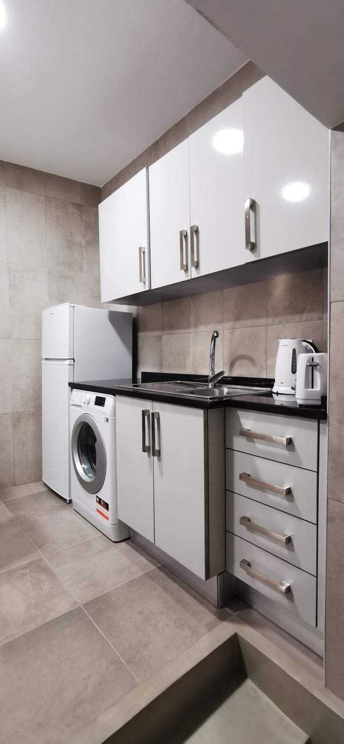 Kitchen or kitchenette, washing machine