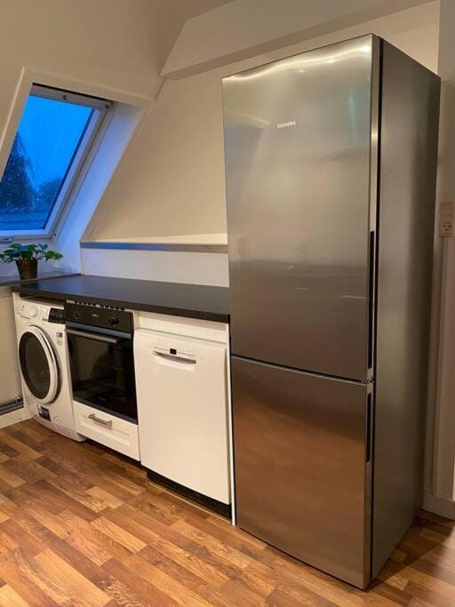 Kitchen or kitchenette, dishwasher, oven, washing machine, dryer