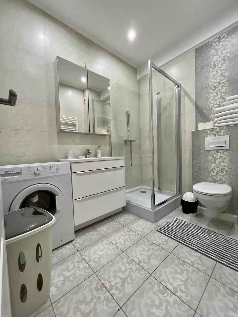 Shower, Toilet, Bathroom, towels, washing machine, dryer