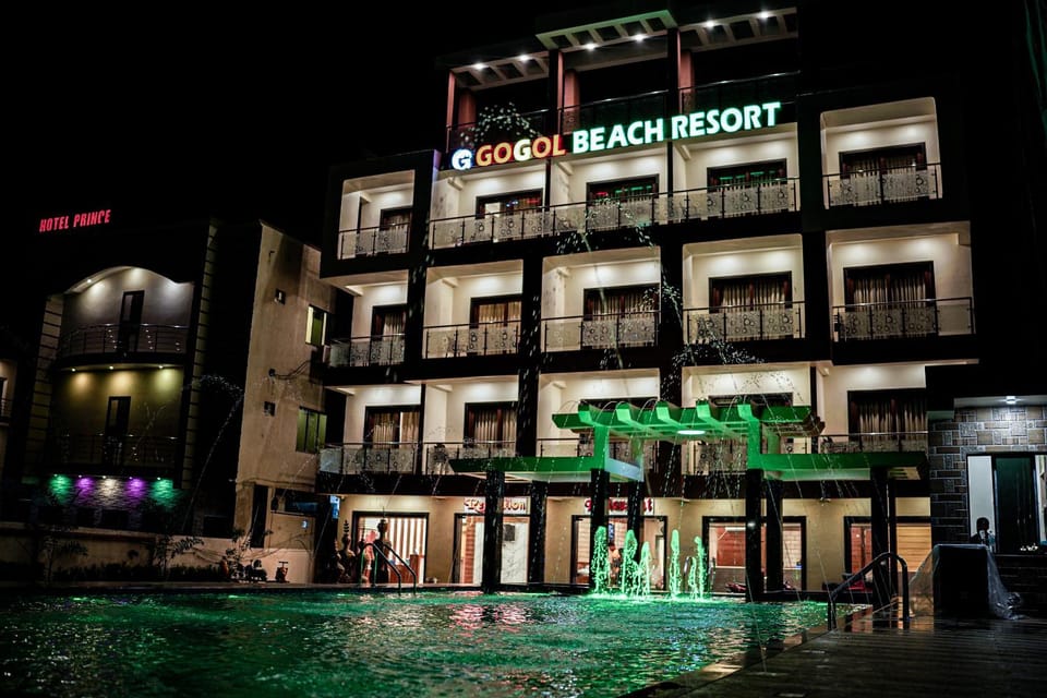 Property building, Facade/entrance, Night, Evening entertainment, Pool view, Swimming pool