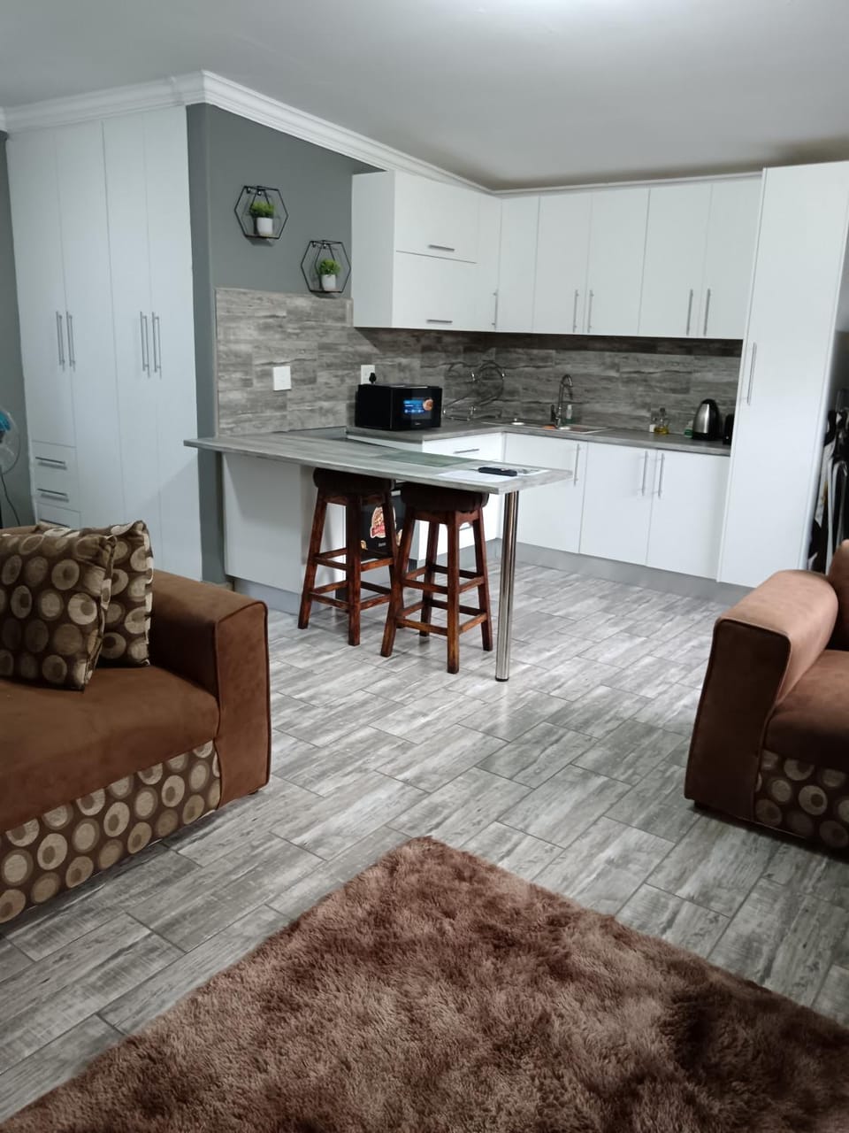 Kitchen or kitchenette, Living room, Seating area, stove