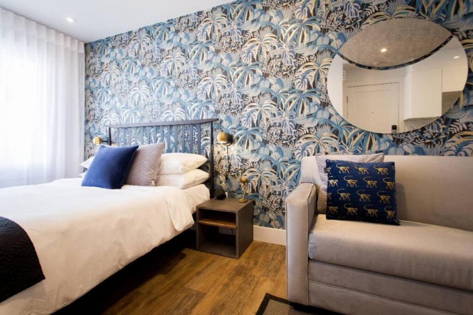 Bed, Living room, Seating area, Bedroom