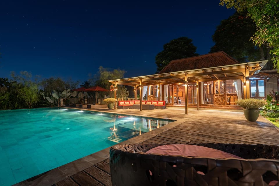 Property building, Patio, Night, Pool view, Swimming pool, sunbed