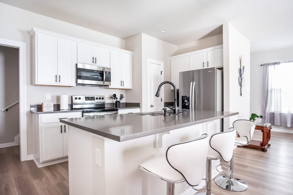 Kitchen or kitchenette, dishwasher, oven, stove