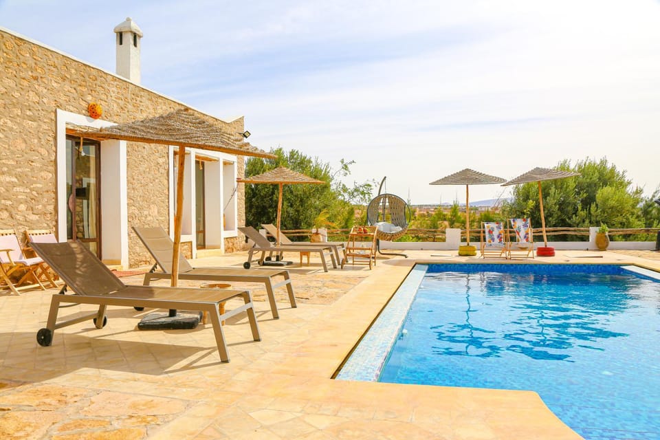 Patio, Day, Natural landscape, Pool view, Swimming pool, sunbed