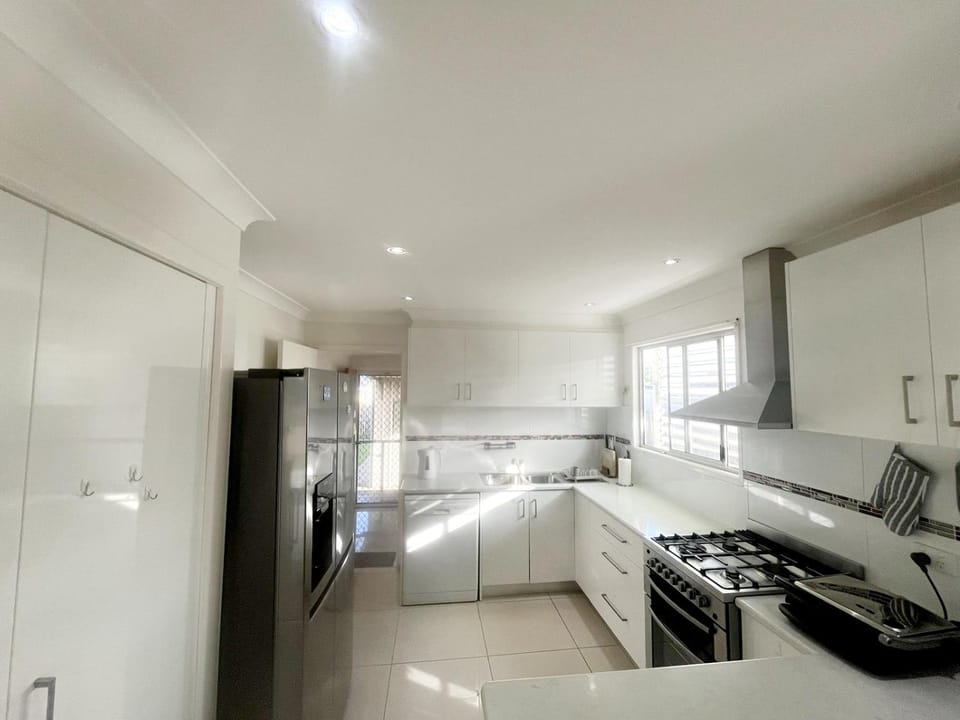 Kitchen or kitchenette, dishwasher, oven, stove