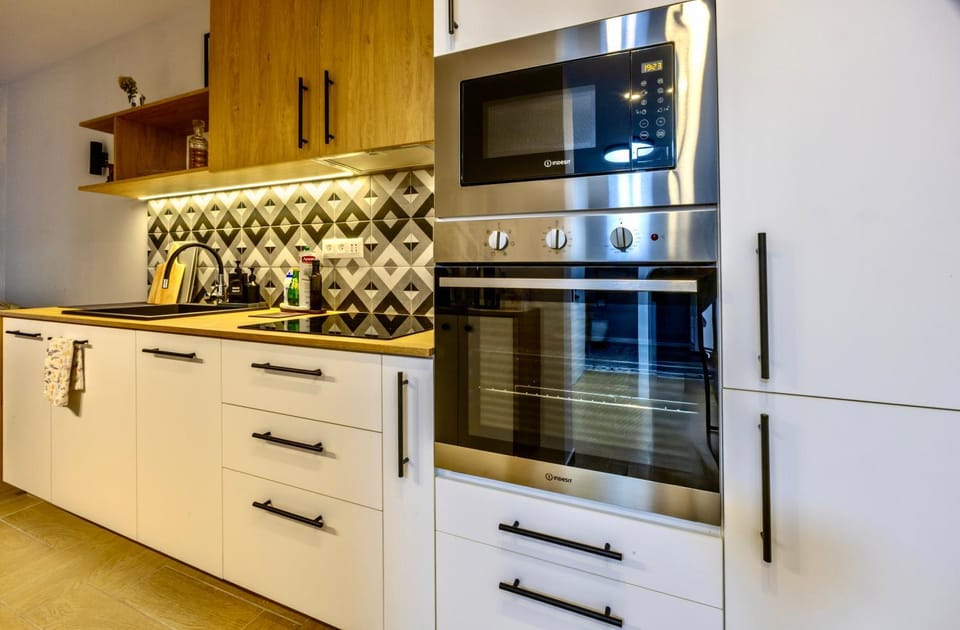 Kitchen or kitchenette, dishwasher, microwave, oven, stove, kitchen