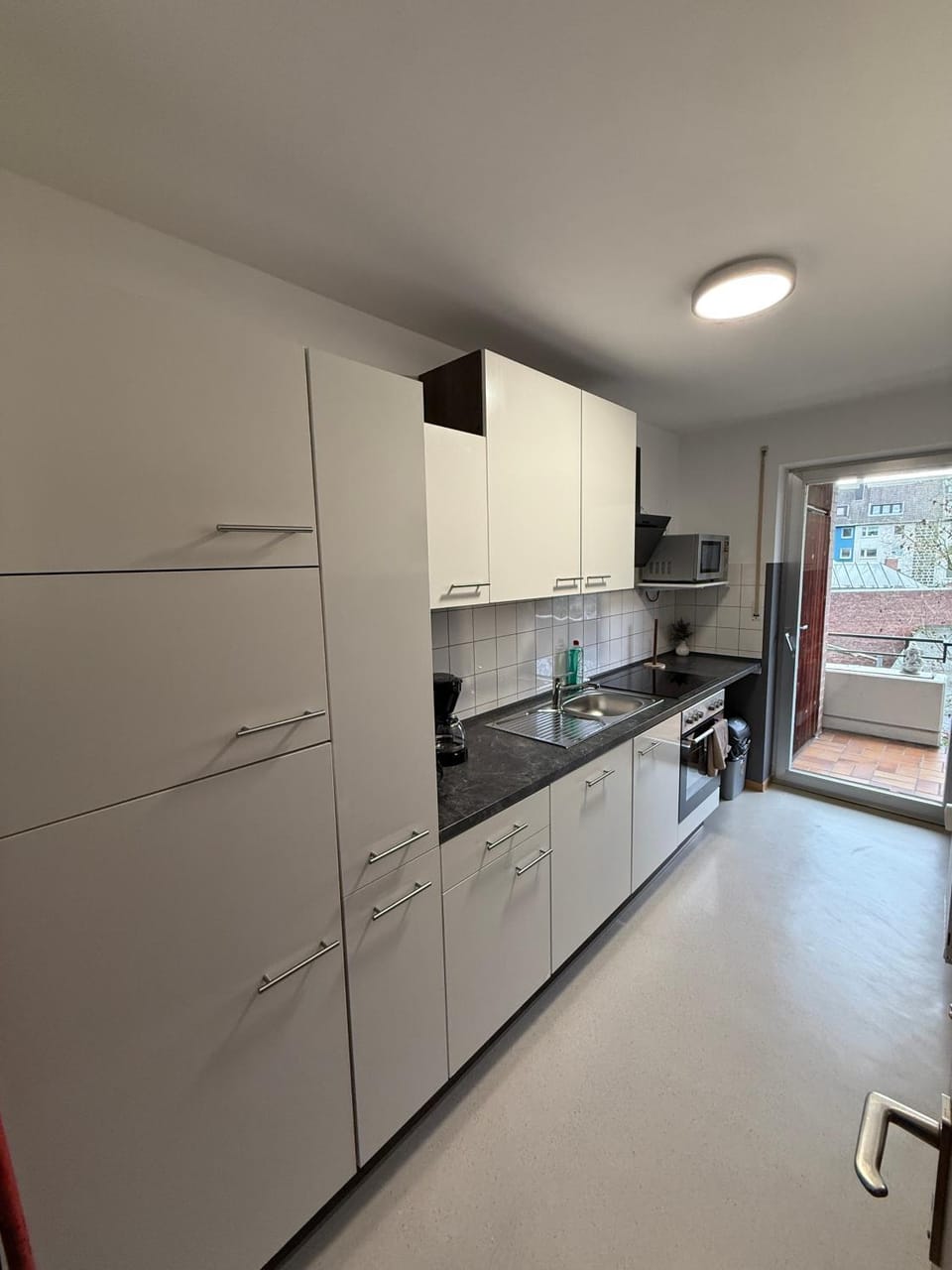 Kitchen or kitchenette, dishwasher, oven, stove