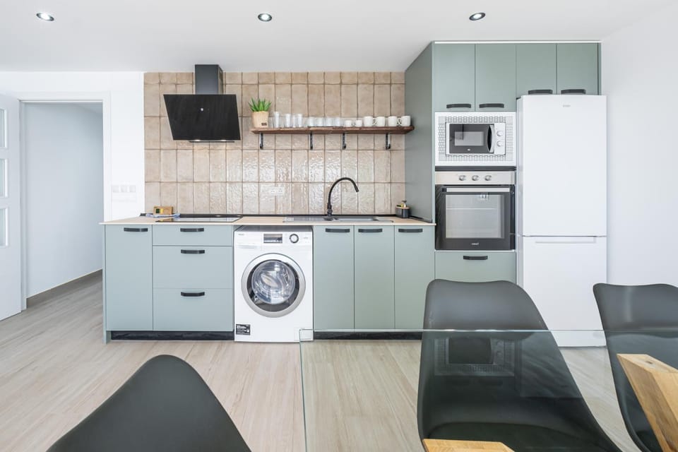 Kitchen or kitchenette, Dining area, microwave, oven, stove, washing machine