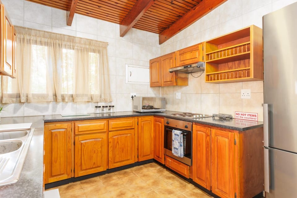 Kitchen or kitchenette, dishwasher, oven, stove