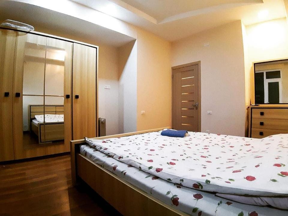 Bed, towels, wardrobe