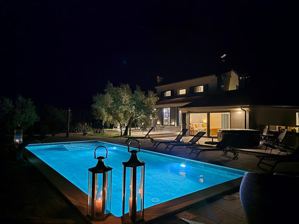 Patio, Night, Pool view, Swimming pool, sunbed