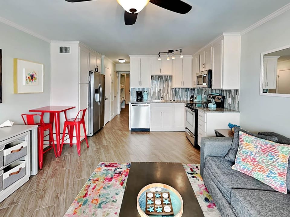 Kitchen or kitchenette, Living room, Seating area, furniture, microwave, stove, kitchen, air conditioner