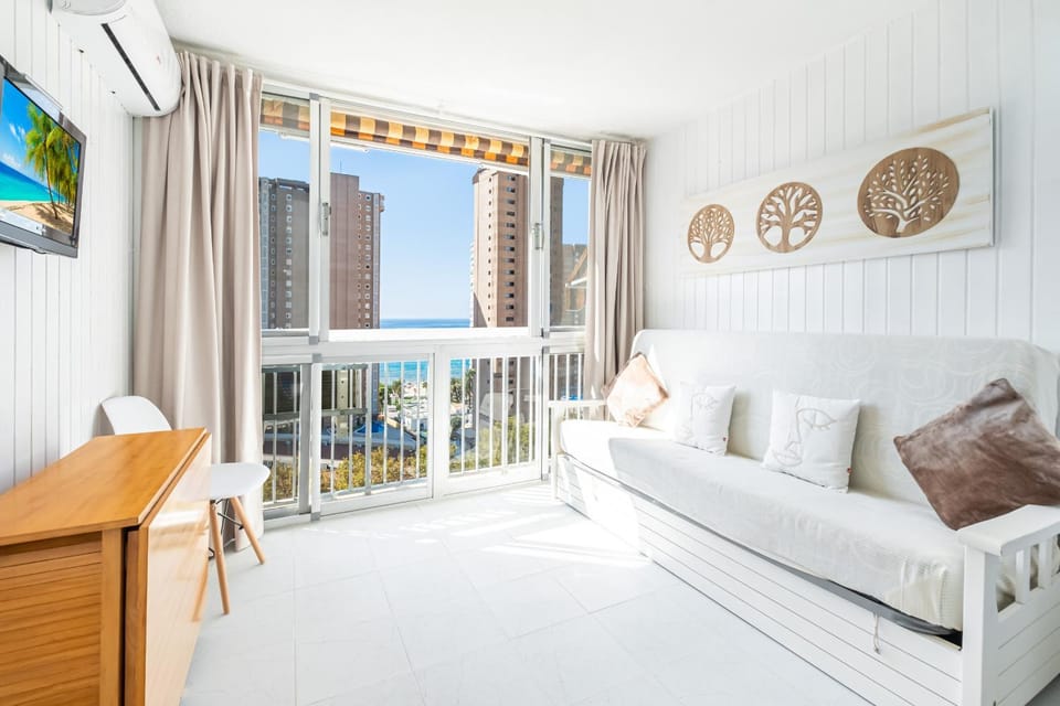 Bed, TV and multimedia, View (from property/room), Living room, City view, Sea view, air conditioner