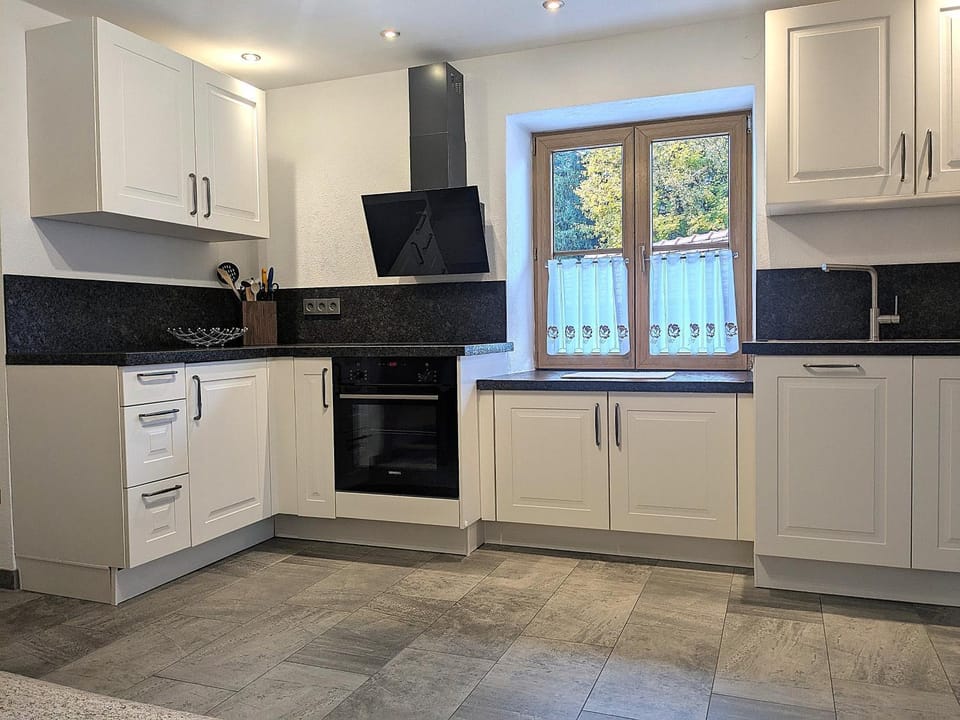Kitchen or kitchenette, dishwasher, oven, stove