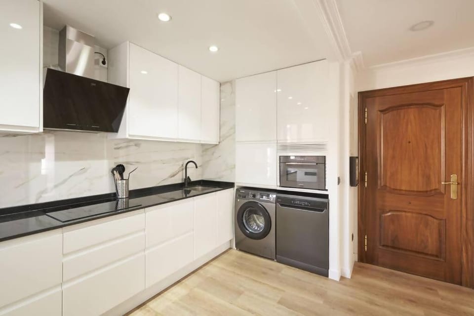 Kitchen or kitchenette, dishwasher, oven, stove, washing machine