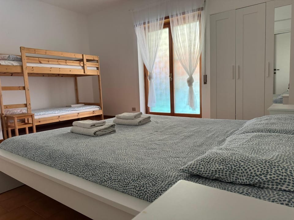 Bed, Photo of the whole room, Bedroom, bunk bed, towels, wardrobe