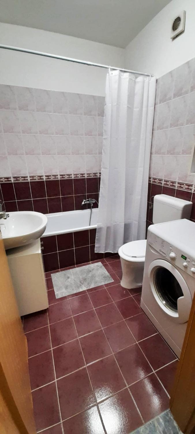Shower, Toilet, Bathroom, Bath, hair dryier, towels, washing machine