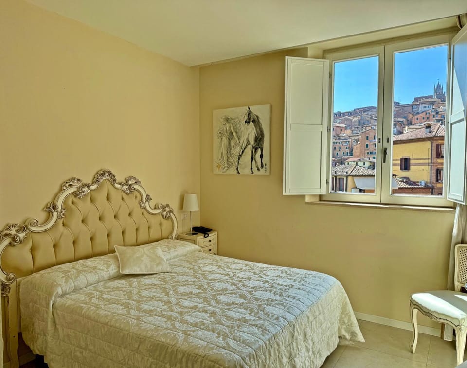 Bed, View (from property/room), City view, Garden view, Landmark view