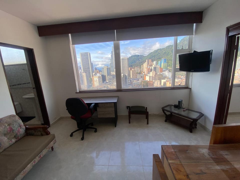 Communal lounge/ TV room, Natural landscape, TV and multimedia, Living room, Seating area, Mountain view