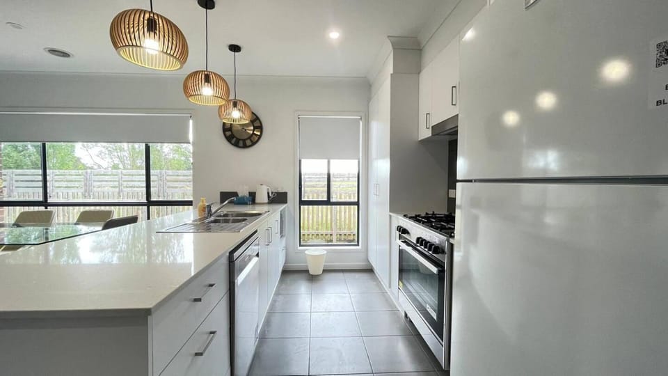 Kitchen or kitchenette, dishwasher, oven, stove