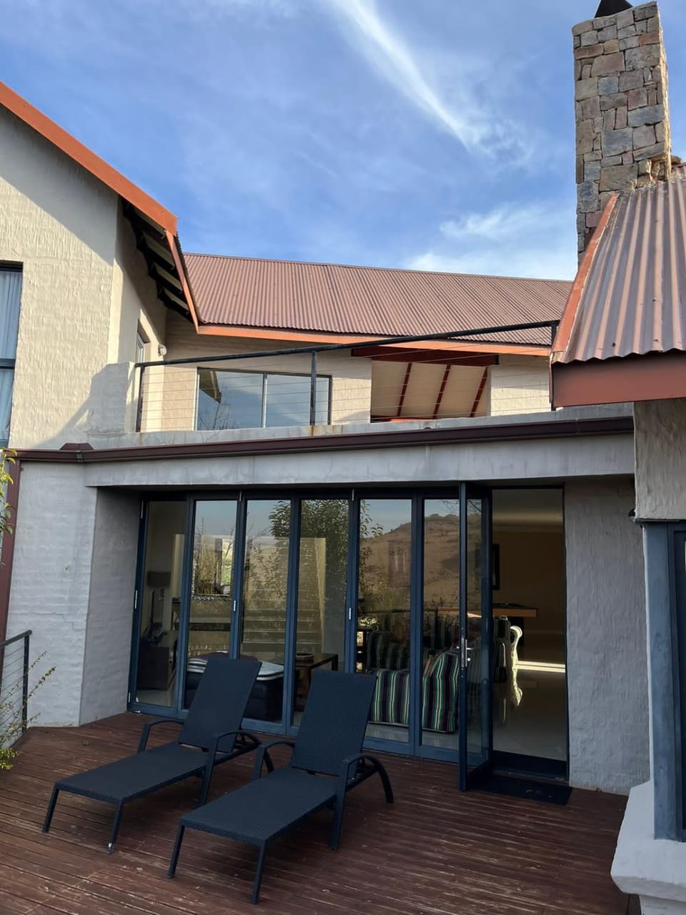 Property building, Patio, Living room, Seating area