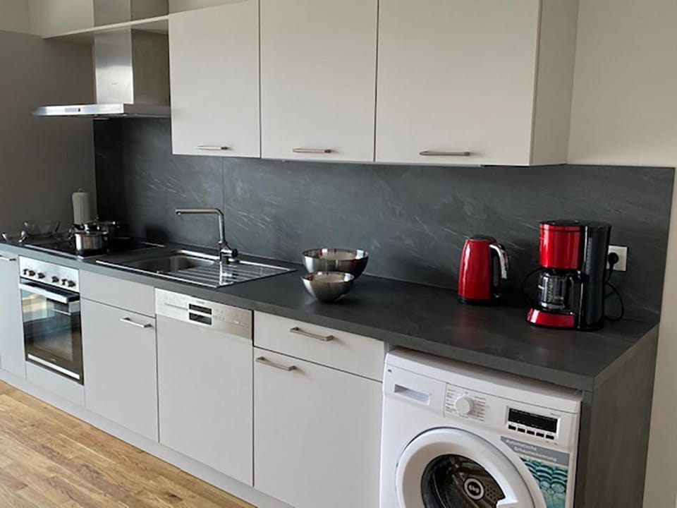 Kitchen or kitchenette, dishwasher, stove, washing machine