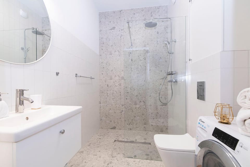 Shower, Toilet, Bathroom, towels, washing machine, dryer