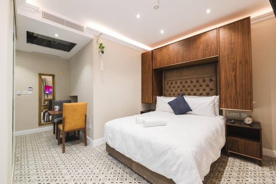 Bed, TV and multimedia, Living room, Seating area, Bedroom, wardrobe, air conditioner