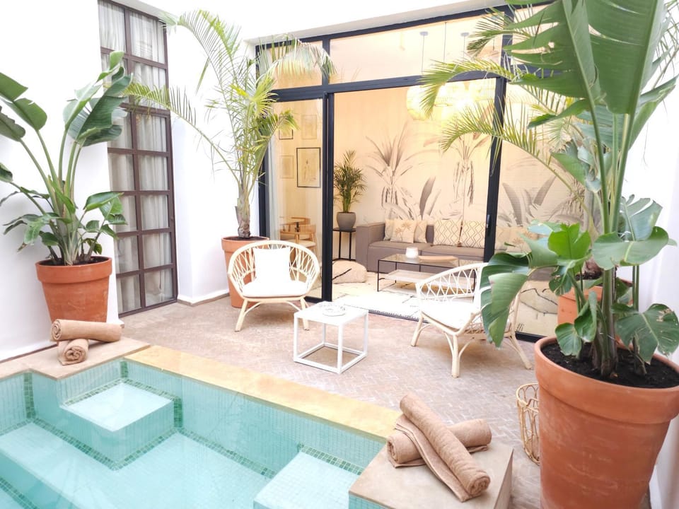 Patio, View (from property/room), Living room, Seating area, Pool view, Swimming pool