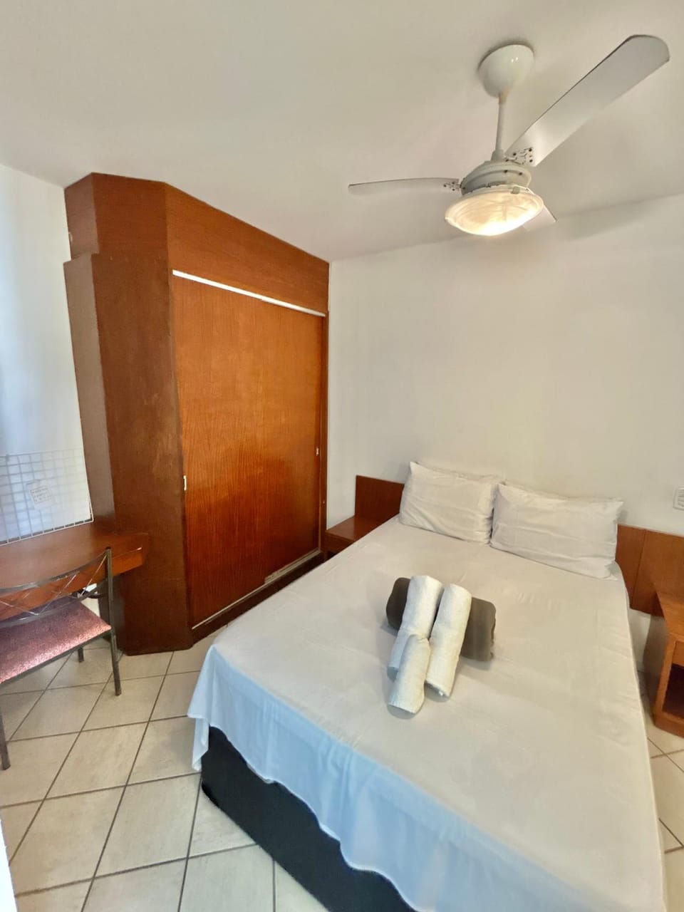 Bed, towels, wardrobe