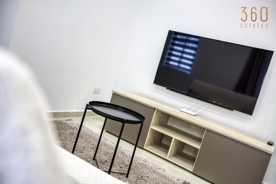 Communal lounge/ TV room, TV and multimedia, Living room, Seating area, Evening entertainment, Text overlay, hair dresser