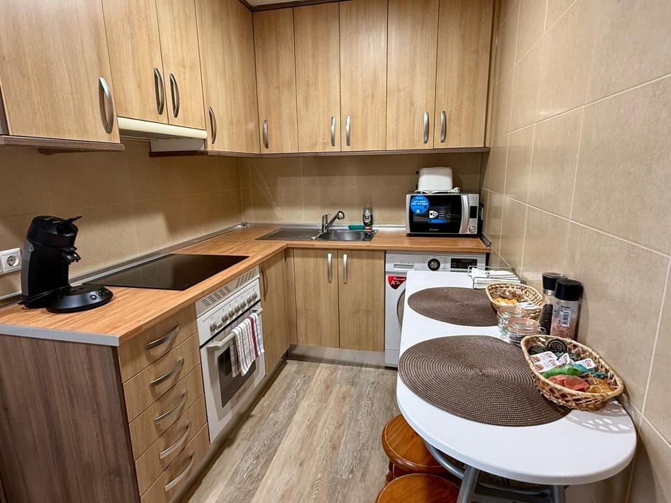 Kitchen or kitchenette, microwave, oven, stove, toaster