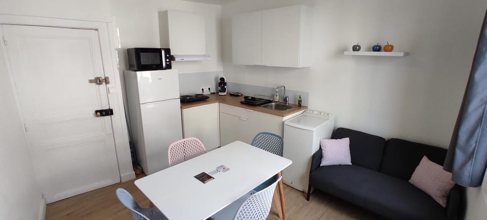 Living room, Seating area, Dining area, microwave, stove, washing machine, kitchen
