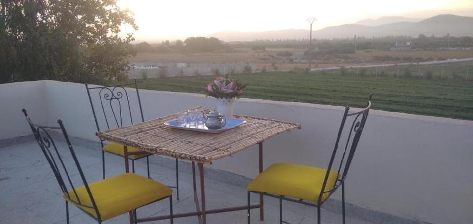 Property building, Patio, Day, People, Natural landscape, View (from property/room), Balcony/Terrace, Living room, Seating area, Dining area, Mountain view, Alcoholic drinks, group of guests