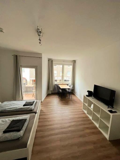 Bed, TV and multimedia, Living room, Seating area, Bedroom