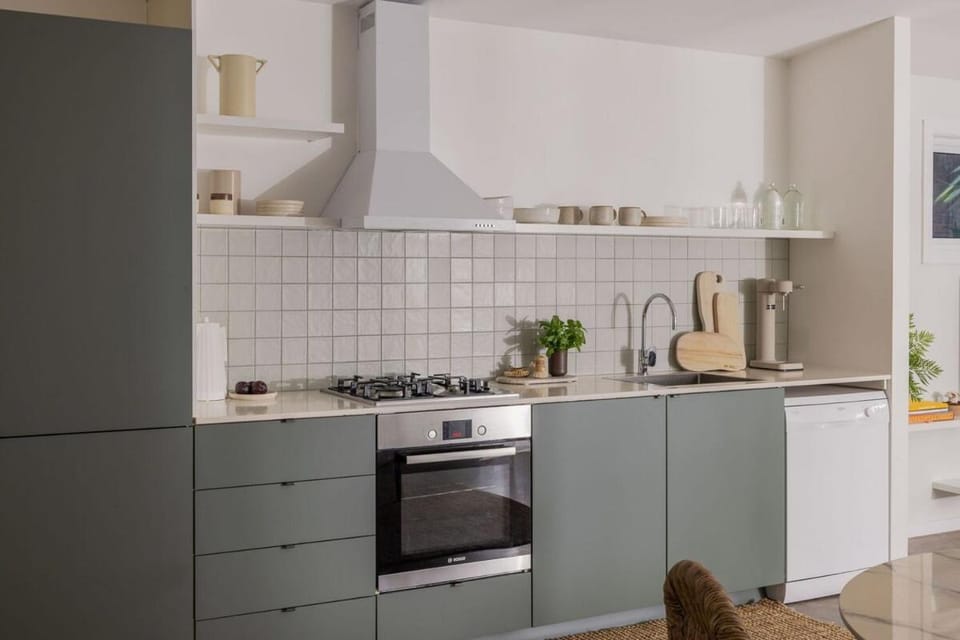 Kitchen or kitchenette, dishwasher, oven, stove