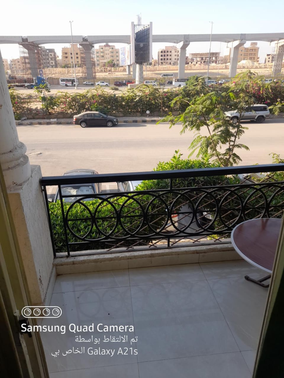 Property building, Day, View (from property/room), Balcony/Terrace, Text overlay, Parking