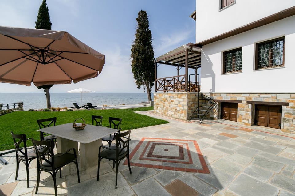 Property building, Patio, Spring, Day, Natural landscape, Garden, View (from property/room), Living room, Seating area, Dining area, Garden view, Sea view
