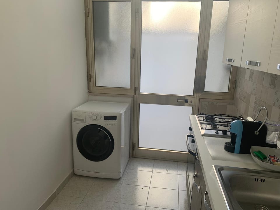Kitchen or kitchenette, washing machine