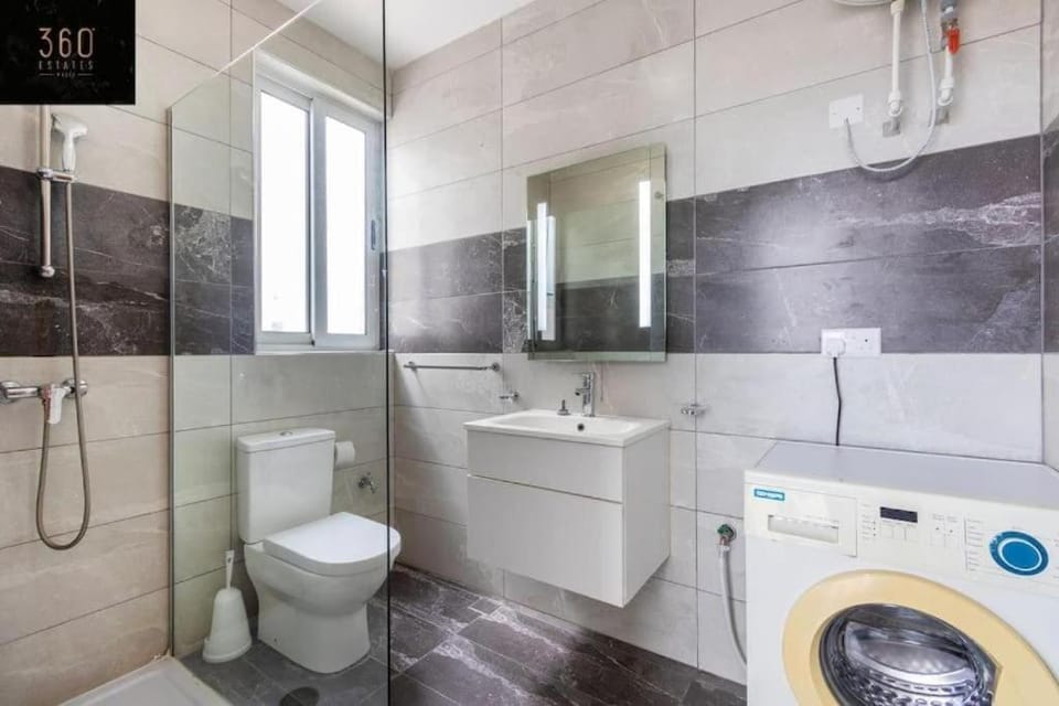 Shower, Toilet, Bathroom, Bath, bidet, towels, washing machine, dryer