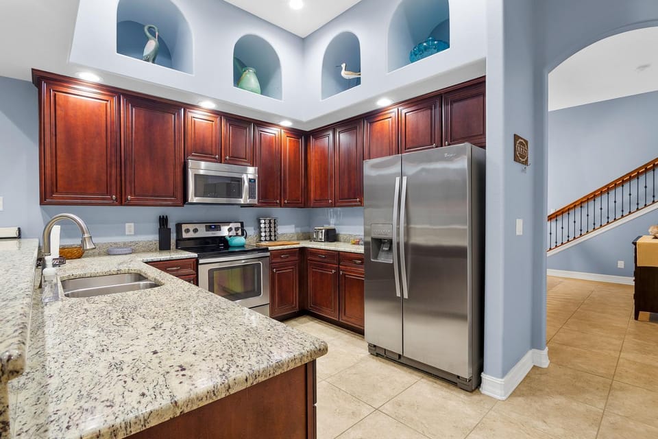 Kitchen or kitchenette, dishwasher, microwave, oven, stove, toaster