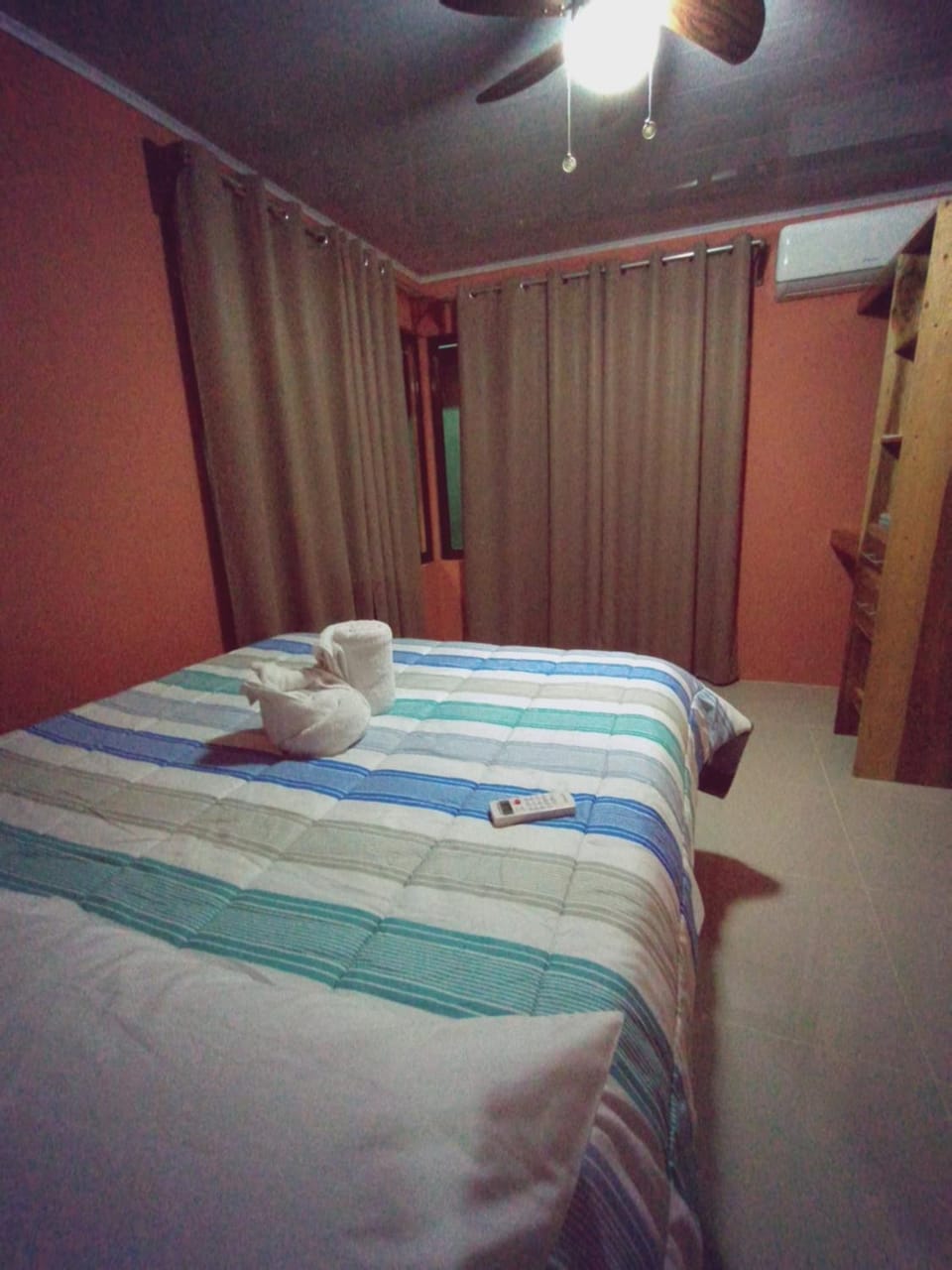 Bed, Photo of the whole room, Decorative detail, Bedroom, Sunset, fireplace, towels, towels, wardrobe, air conditioner