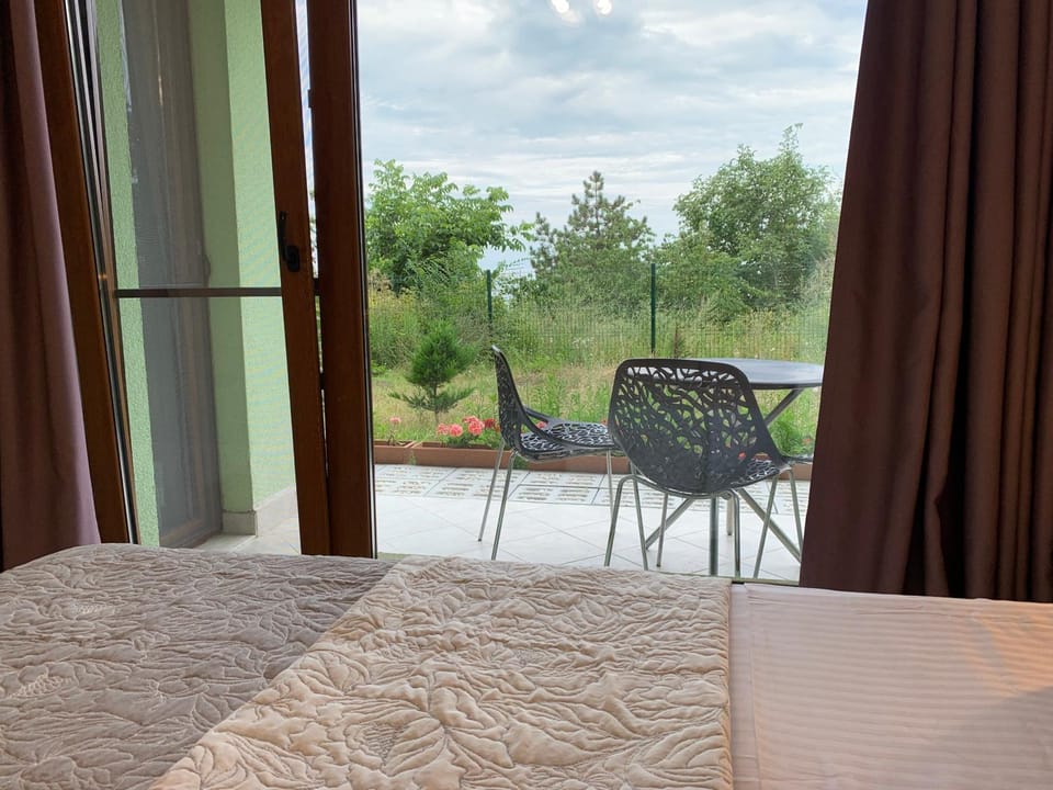 Patio, Bed, Natural landscape, Garden, Garden, View (from property/room), Bedroom, Garden view, Sea view