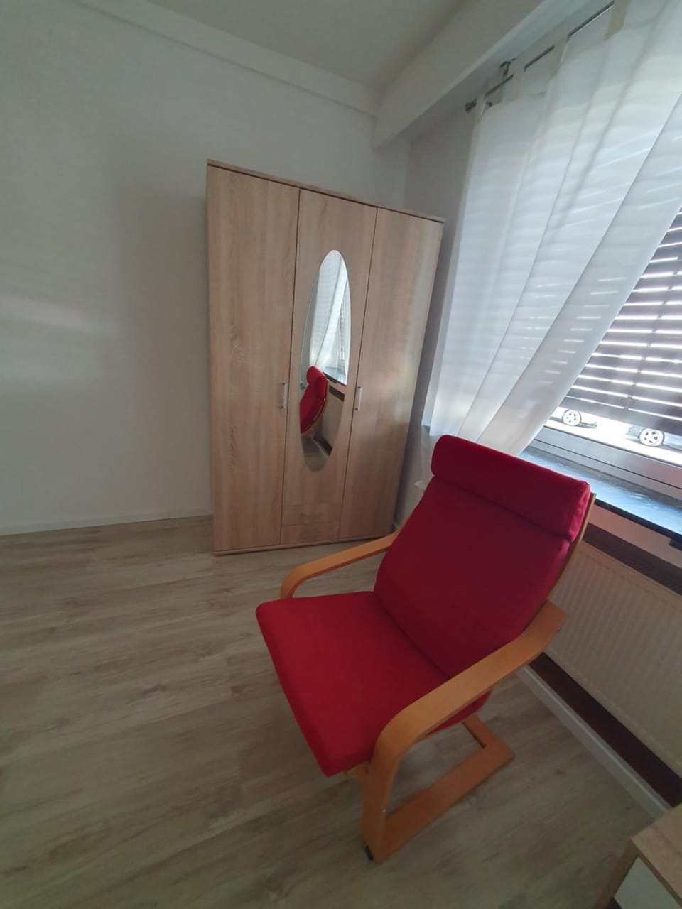 Seating area, towels, wardrobe