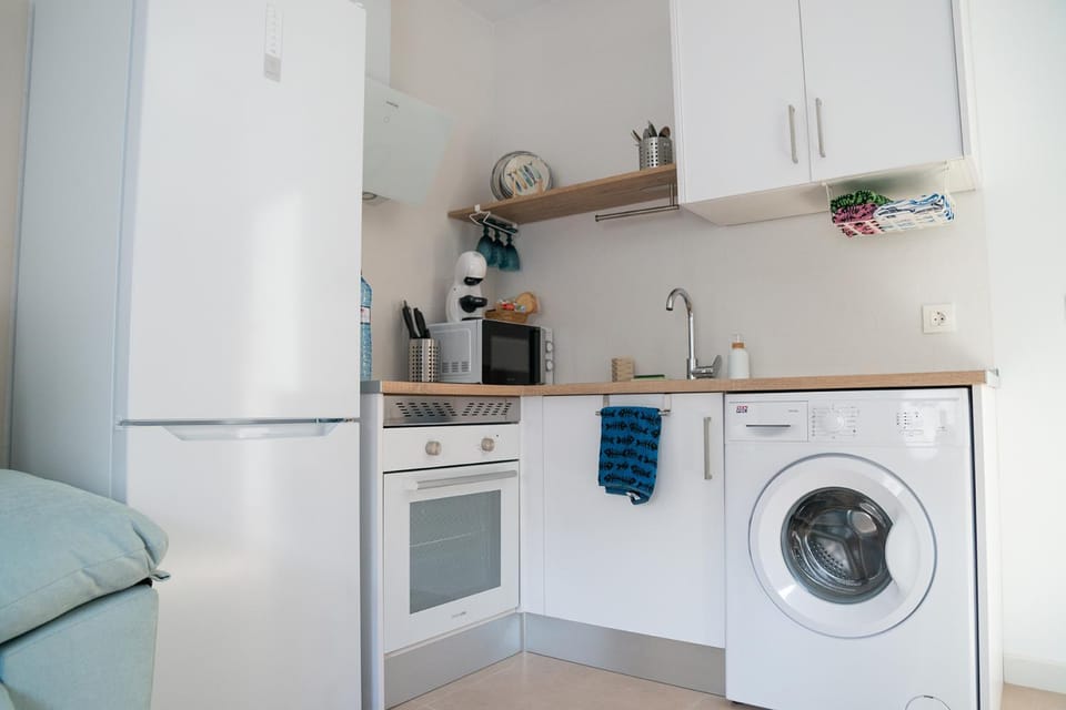 Kitchen or kitchenette, washing machine