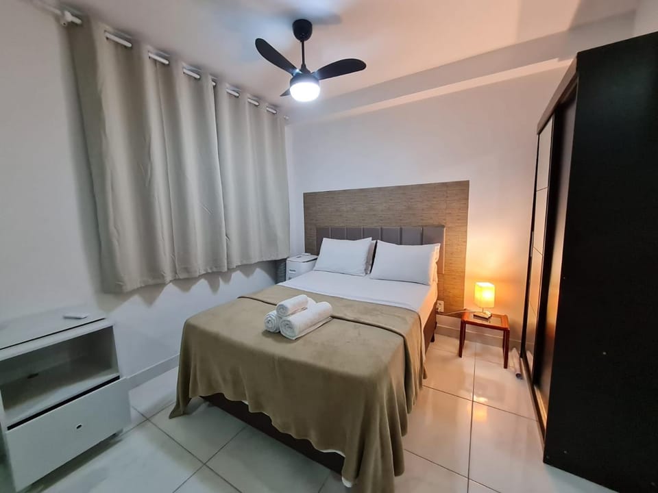 Bed, towels, wardrobe, air conditioner