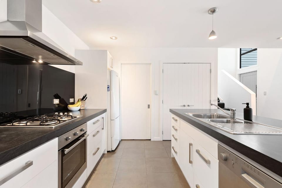 Kitchen or kitchenette, dishwasher, oven, stove