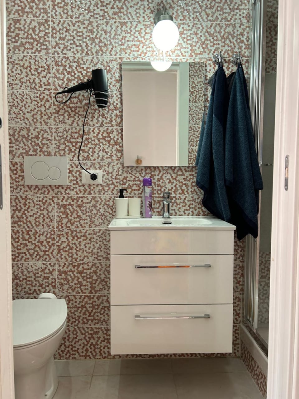 Toilet, Bathroom, hair dryier, towels